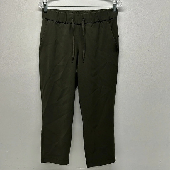 Lululemon On the Fly Crop Pants Leggings Woven 23" Dark Olive Green Size 6 - Picture 1 of 8